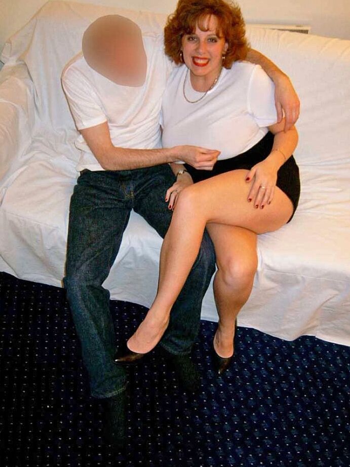 20P Thick older redhead Curvy Claire tit smothers a man with her large breasts