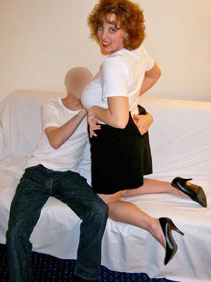 20P Thick older redhead Curvy Claire tit smothers a man with her large breasts