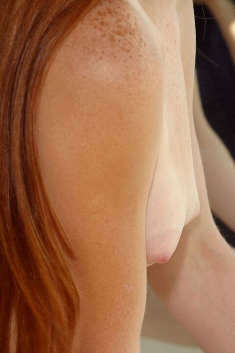 15P Smiley redhead Tiffany Lance jumps into the bathtub and washes herself