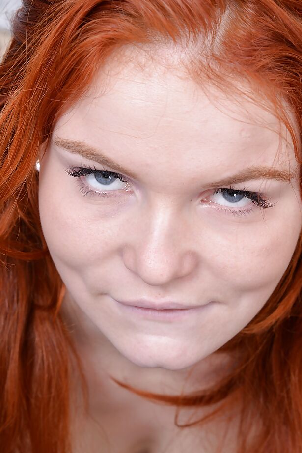 16P Perky redhead amateur with unshaven slit undressing and spreading her legs