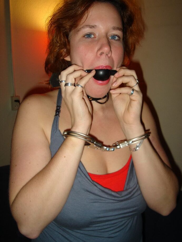 20P Natural redhead dons a ball gag and handcuffs before masturbating in boots