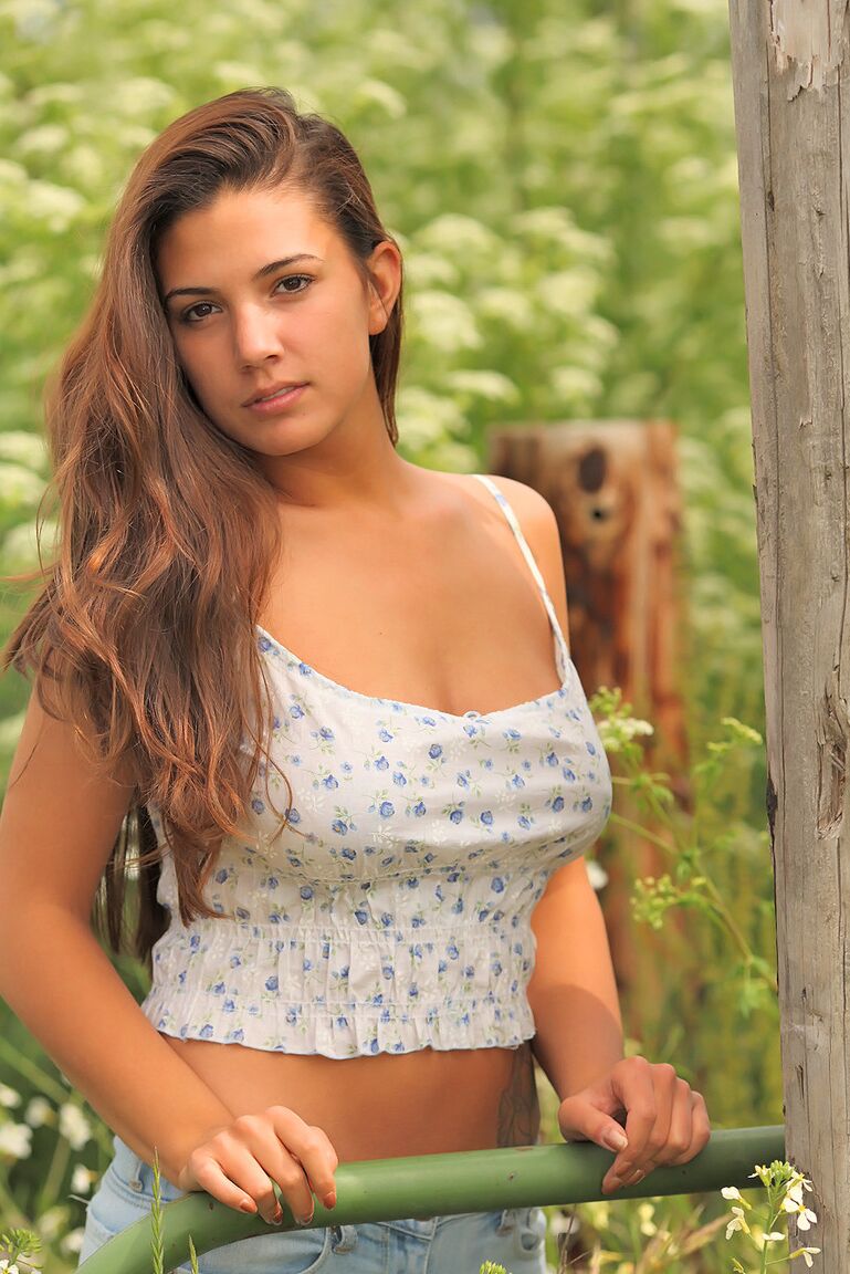 16P Gorgeous brunette Jaycee West bares her huge nipples at the garden gate