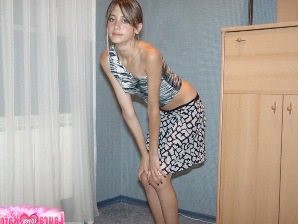 15P Thin teen strips naked before crawling on carpet flooring in solo action