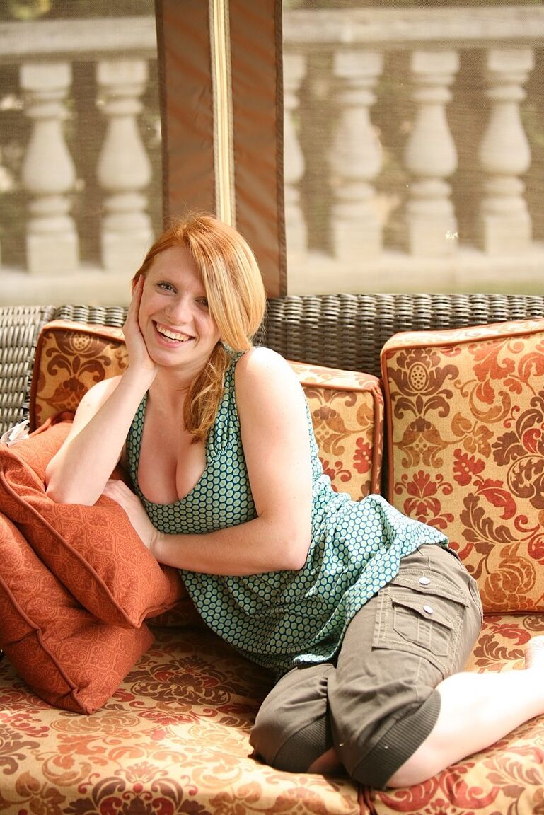 21P Amateur redhead with big juggs Lilly Killian unveils her bald cunt on a couch