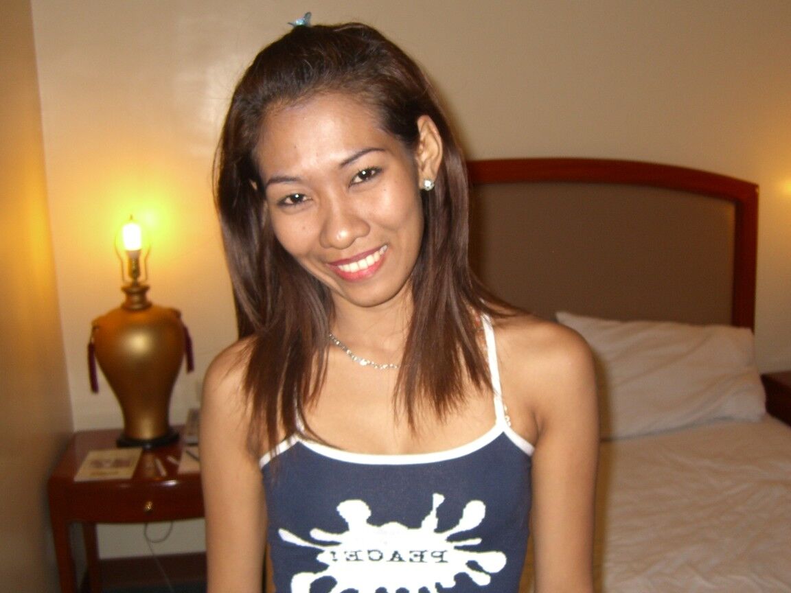 20P Asian first timer makes her nude debut on top of white bed sheets