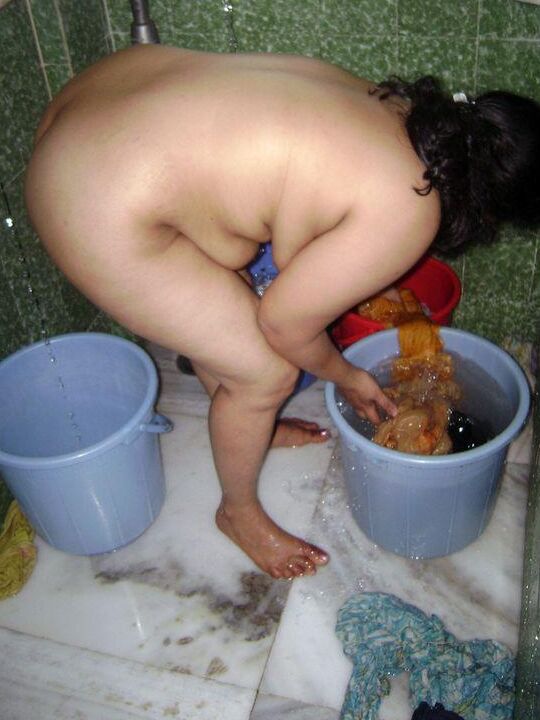 10P Indian fatty washes her clothes while taking a shower at the same time