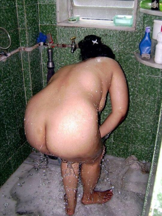 10P Indian fatty washes her clothes while taking a shower at the same time