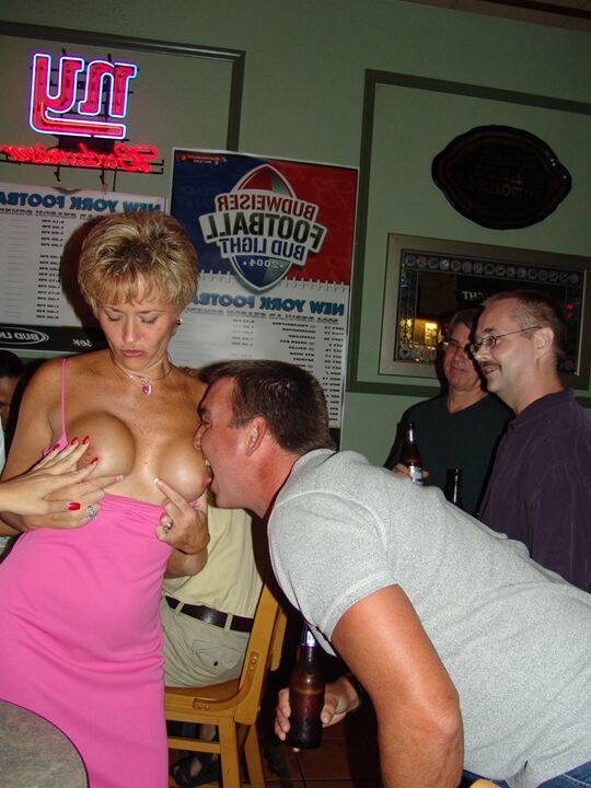21P Chesty swinger Double Dee lets different men suck her big titties at the bar
