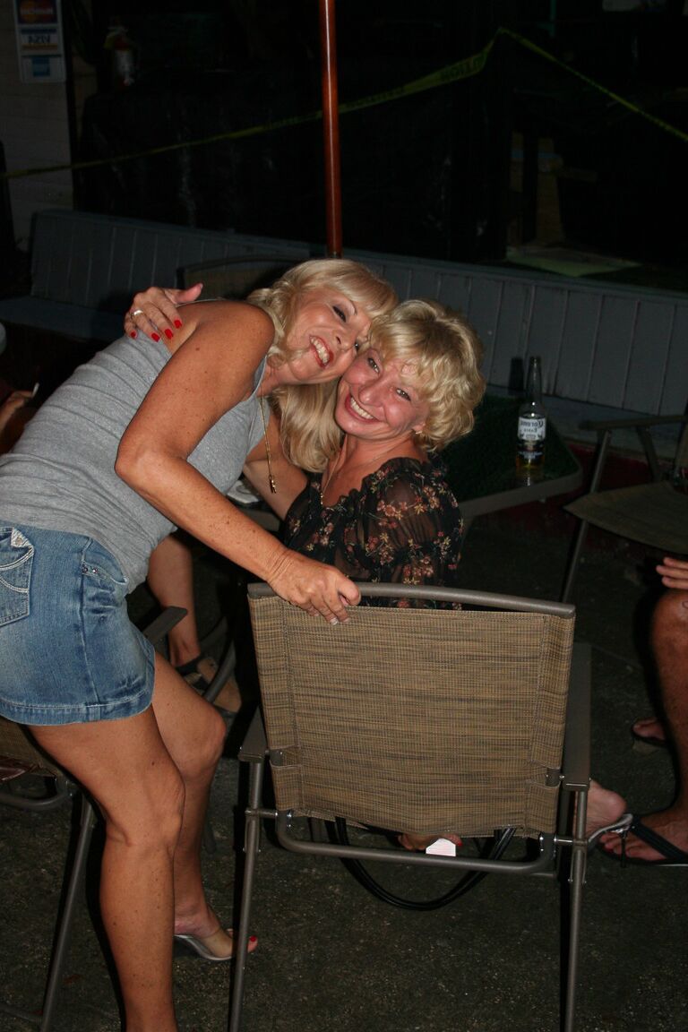 21P Slutty swinger wives French kiss and pose provocatively at a party