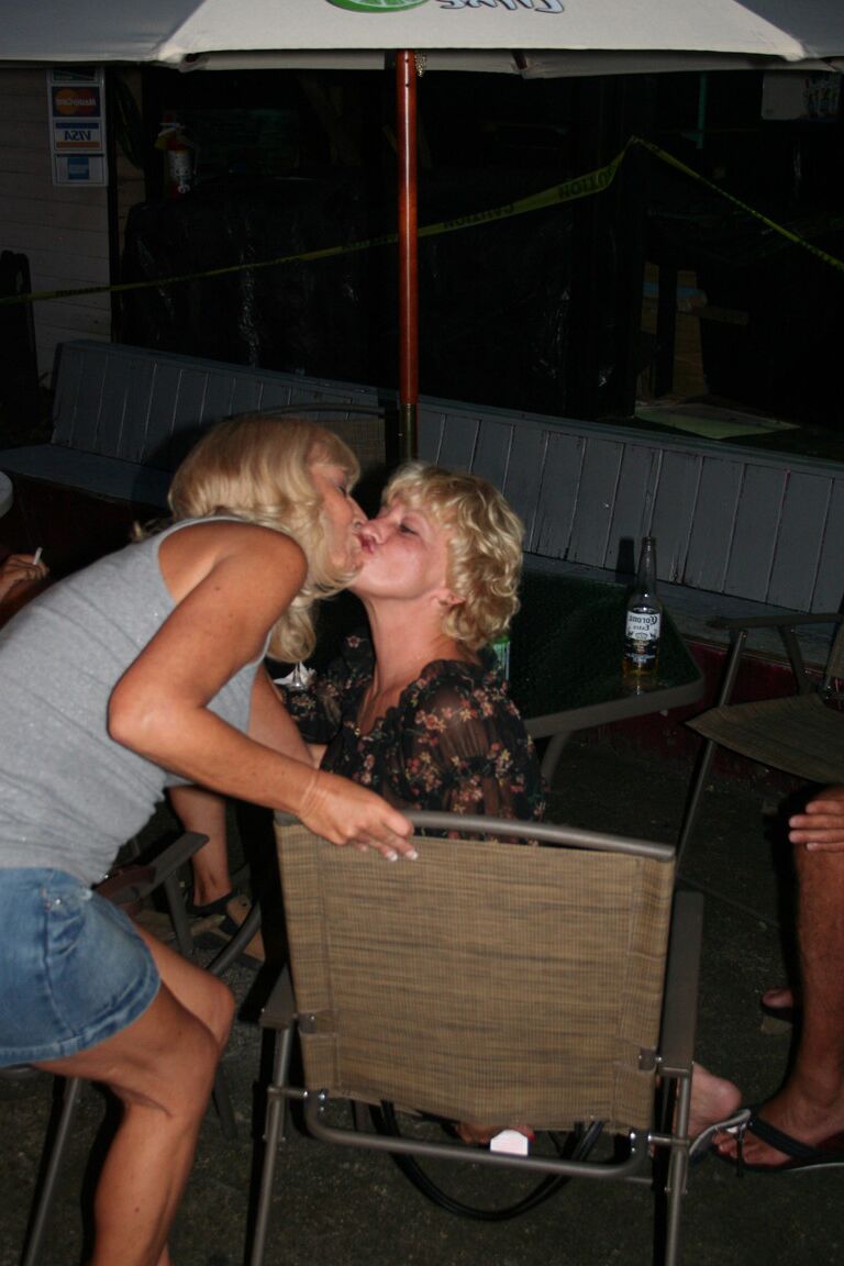 21P Slutty swinger wives French kiss and pose provocatively at a party