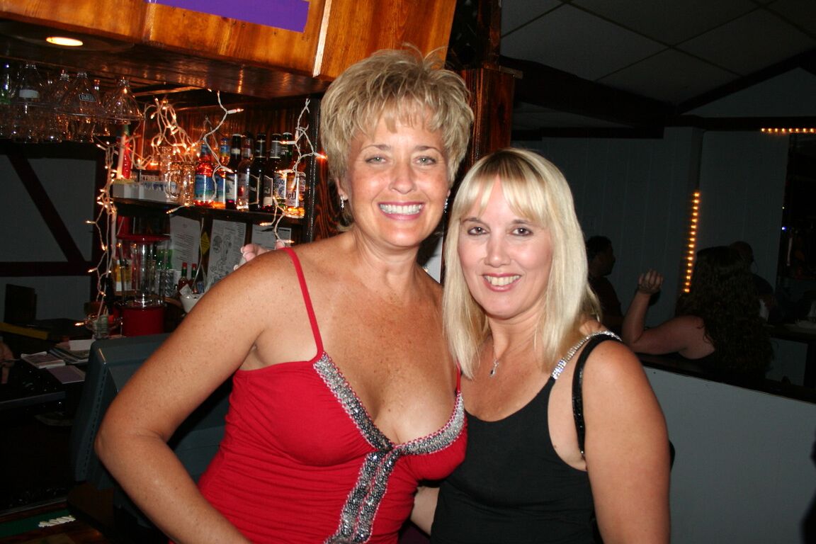 21P Slutty swinger wives French kiss and pose provocatively at a party