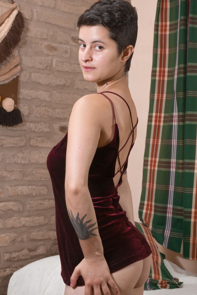 17P Stacked tattooed Sue with hairy armpits strips on the bed & shows furry butt