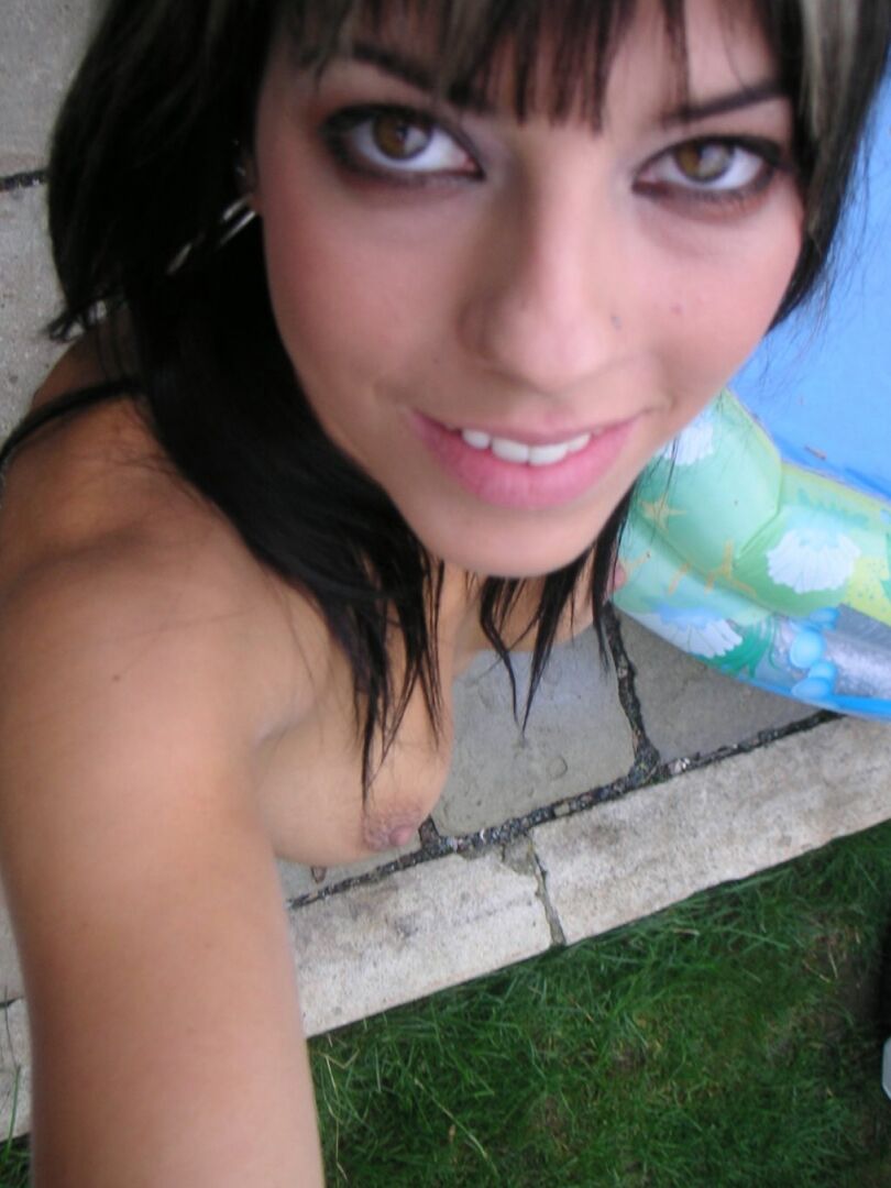 21P Cute babe with small tits Mellie Swan poses and flaunts her shaved vagina