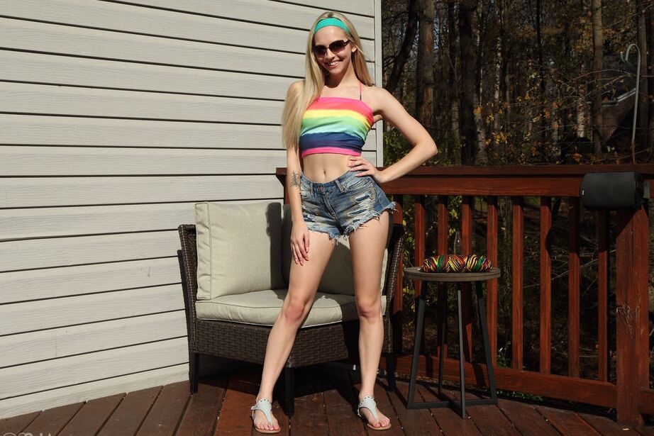 16P Blonde teen Lily Larimar eats a banana during vaginal insertions on a deck