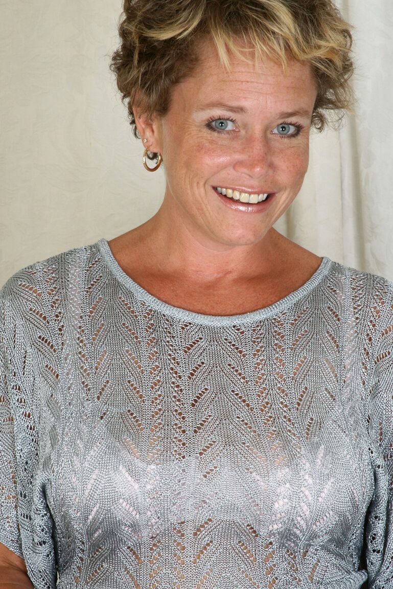 21P Blue eyed MILF with big tits Ariel undresses and poses on a table