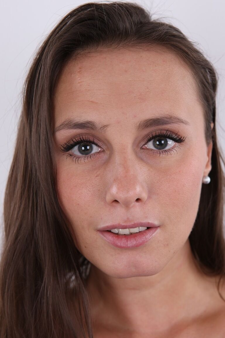 20P First timer Veronika stands fully clothed before getting bare naked
