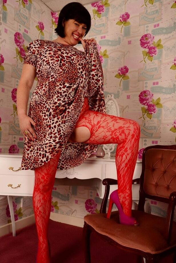 20P Older British amateur Juicey Janey shows her big tits in a crotchless stocking