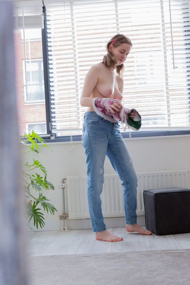16P Hidden spy camera captures a solo girl pulling on her panties and blue jeans