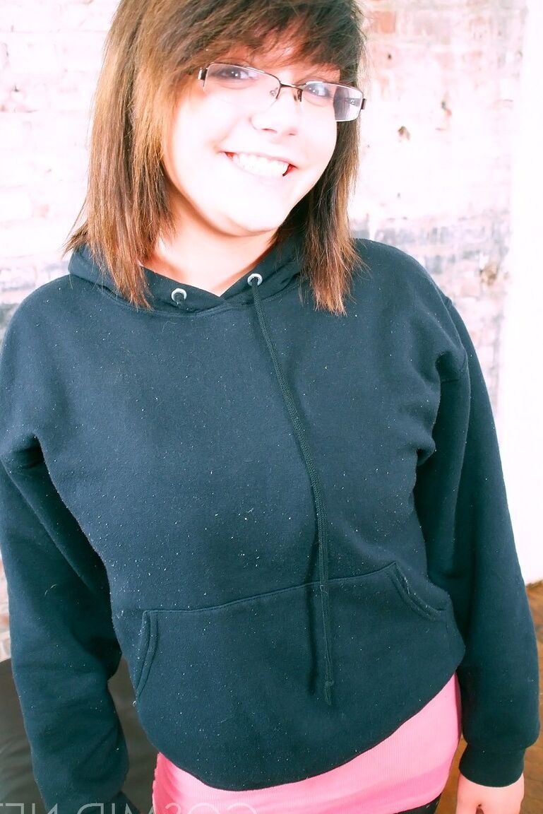 16P Cute brunette Morgan uncups her enhanced tits with her glasses on