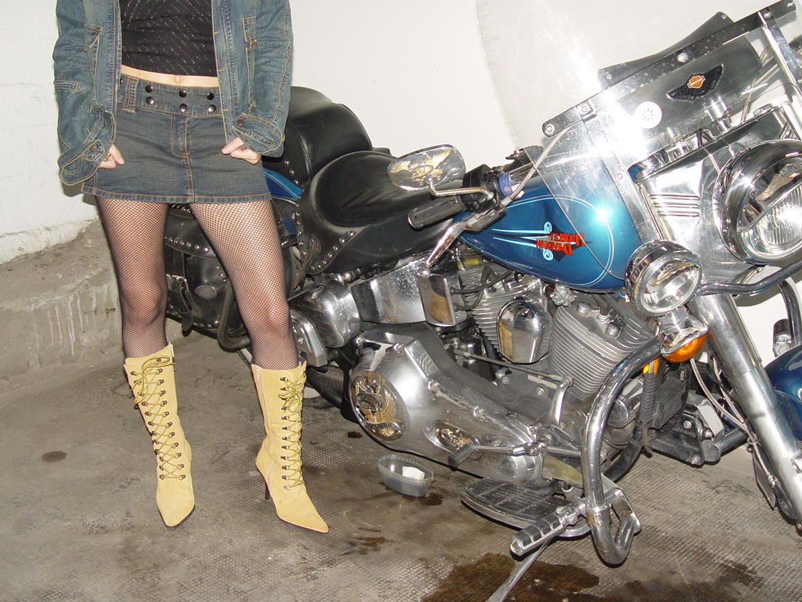 16P Biker chick Vivian models on a motorcycle in mesh pantyhose with no panties