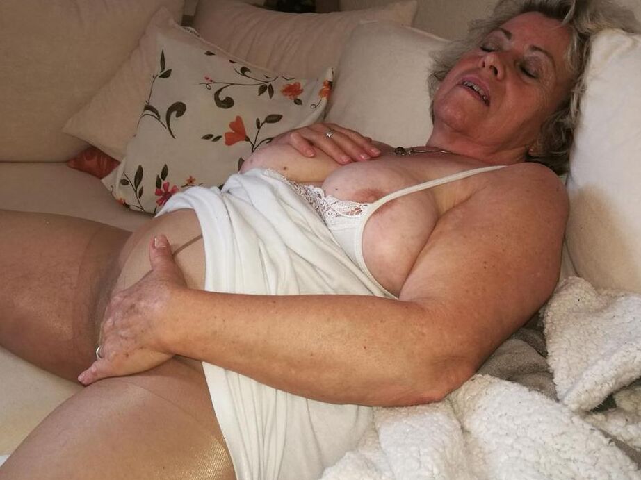 20P Horny grandmother slides hands down pantyhose to masturbate