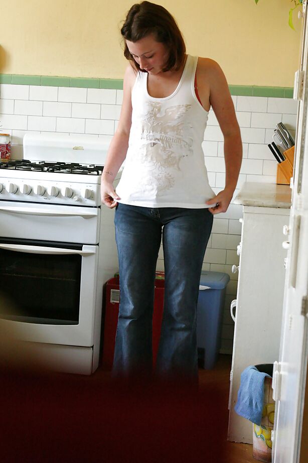 16P Hidden camera catches nude girl getting dressed in the kitchen