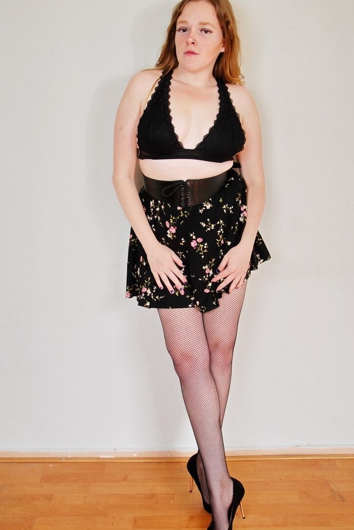 16P Natural redhead uncups her small tits while wearing back seem nylons