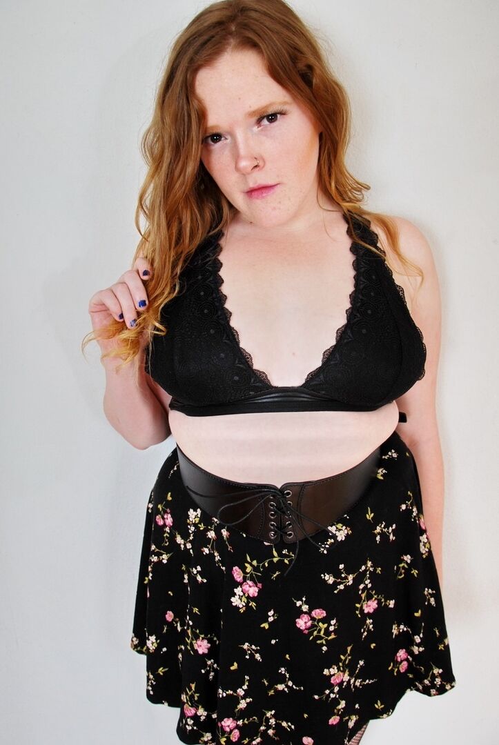 16P Natural redhead uncups her small tits while wearing back seem nylons