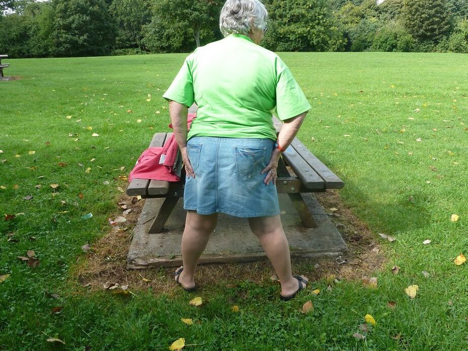 20P Obese oma Grandma Libby exposes her large tits and butt on a picnic table