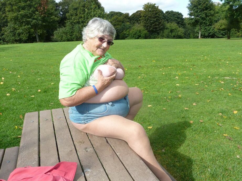 20P Obese oma Grandma Libby exposes her large tits and butt on a picnic table
