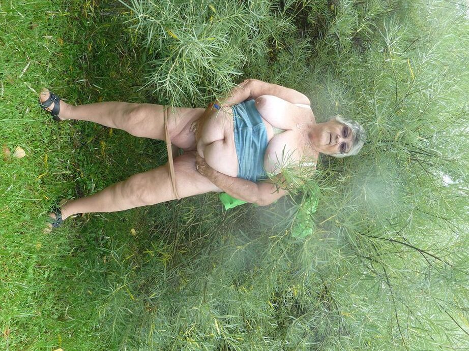 20P Obese oma Grandma Libby exposes her large tits and butt on a picnic table