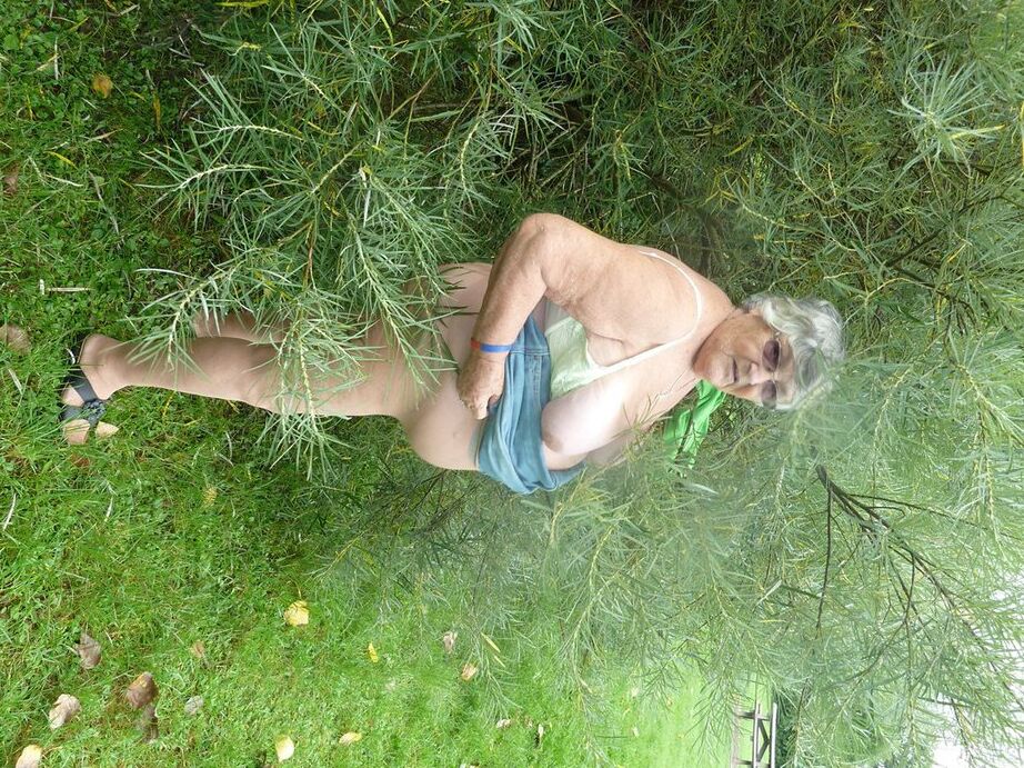 20P Obese oma Grandma Libby exposes her large tits and butt on a picnic table