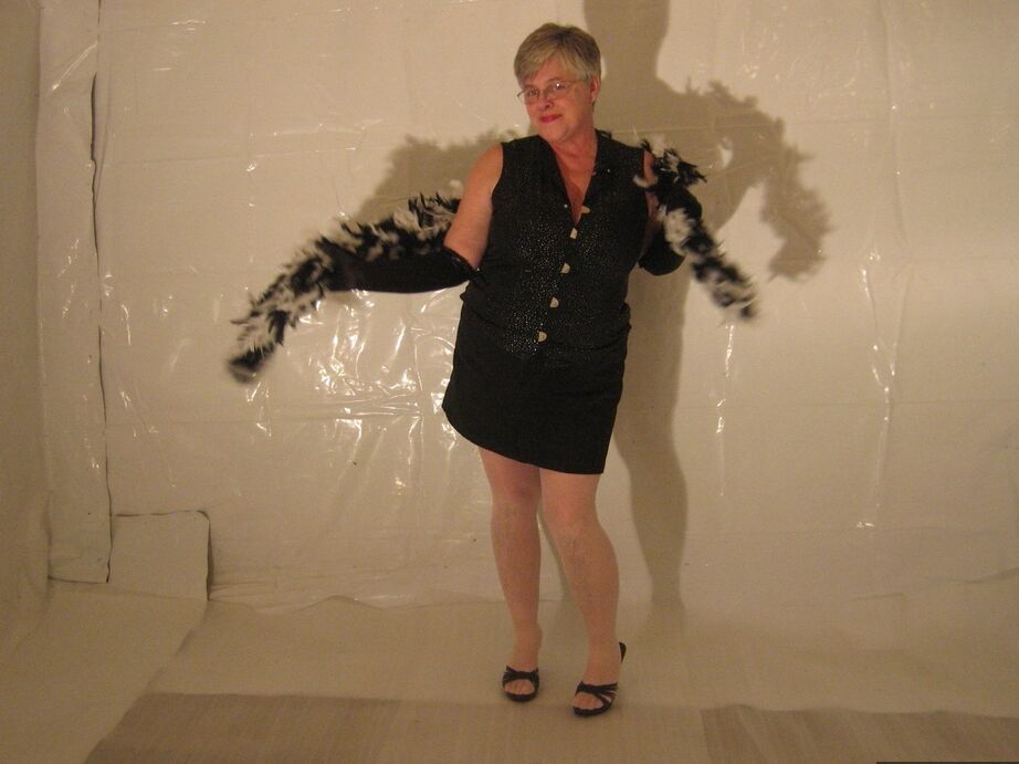 20P Silver haired granny Girdle Goddess puts on a strip show in long black gloves