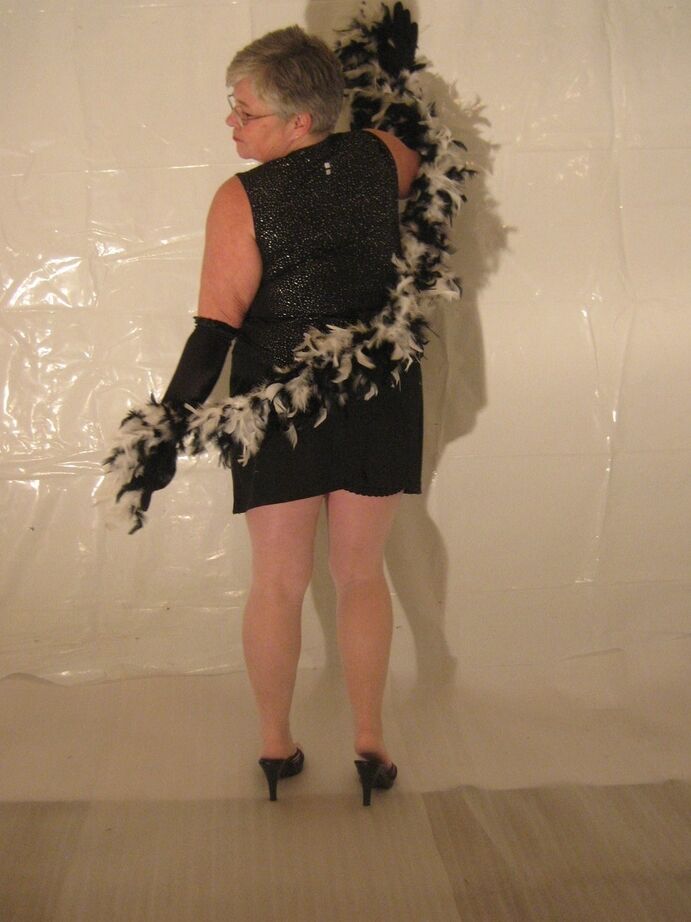 20P Silver haired granny Girdle Goddess puts on a strip show in long black gloves