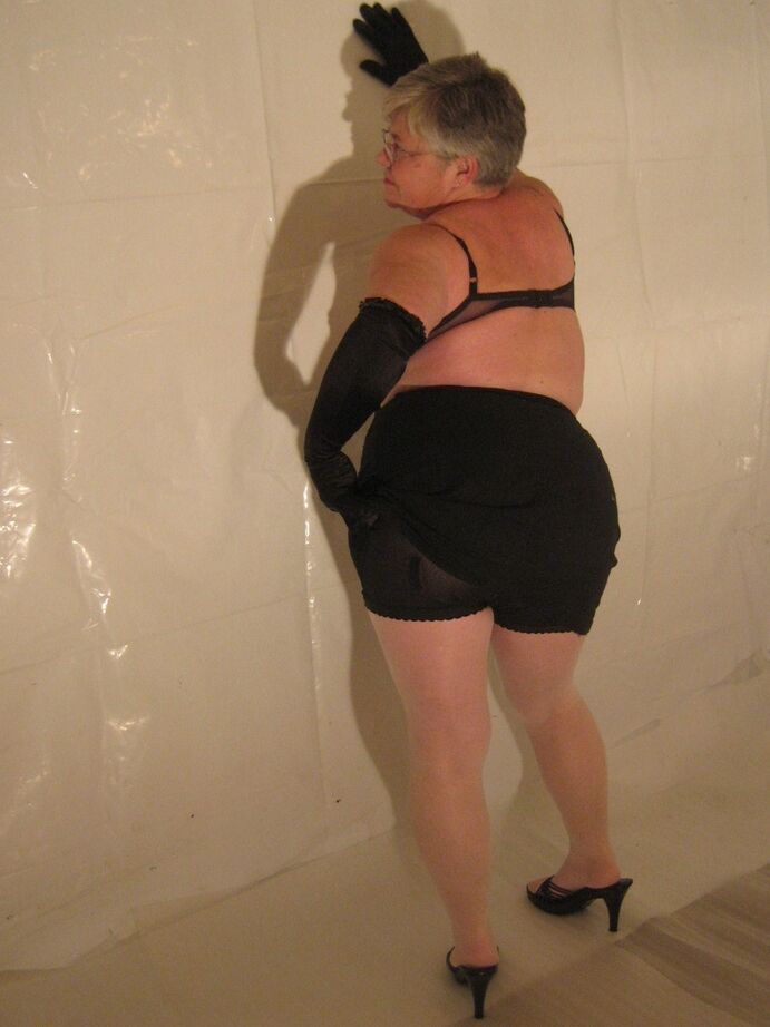 20P Silver haired granny Girdle Goddess puts on a strip show in long black gloves