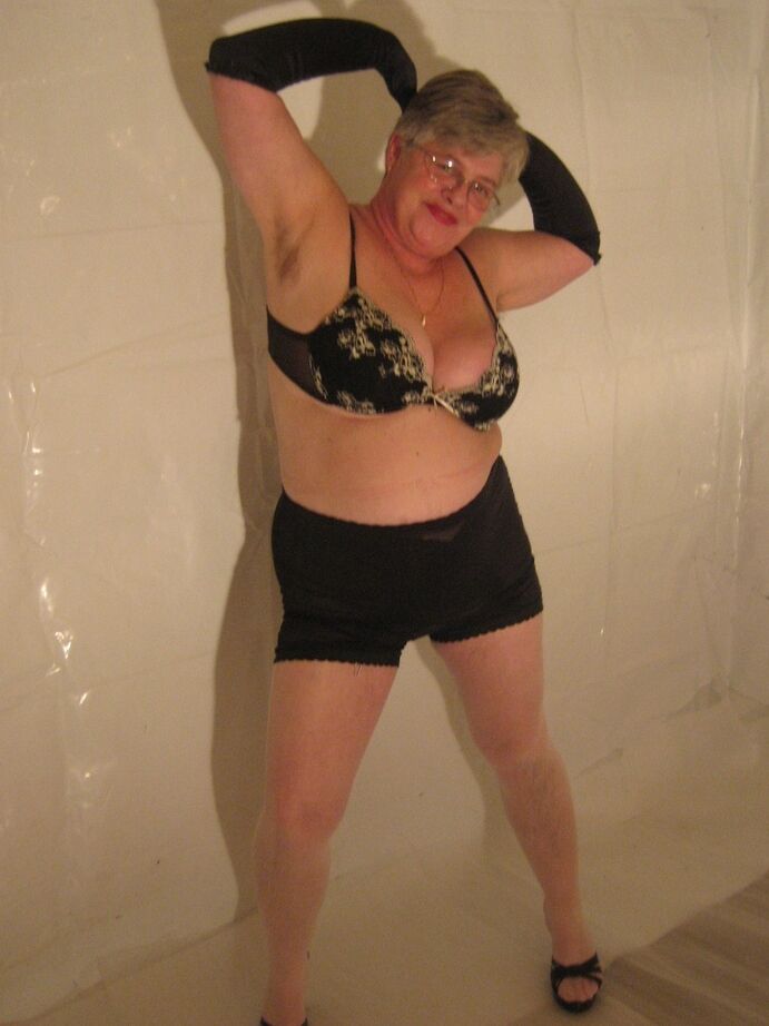 20P Silver haired granny Girdle Goddess puts on a strip show in long black gloves