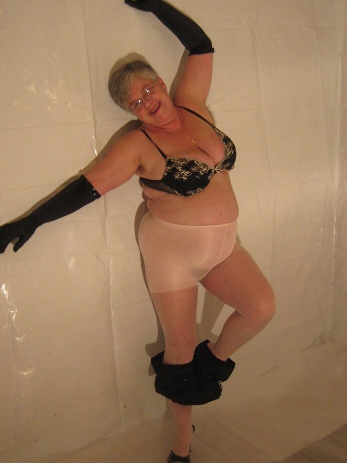 20P Silver haired granny Girdle Goddess puts on a strip show in long black gloves