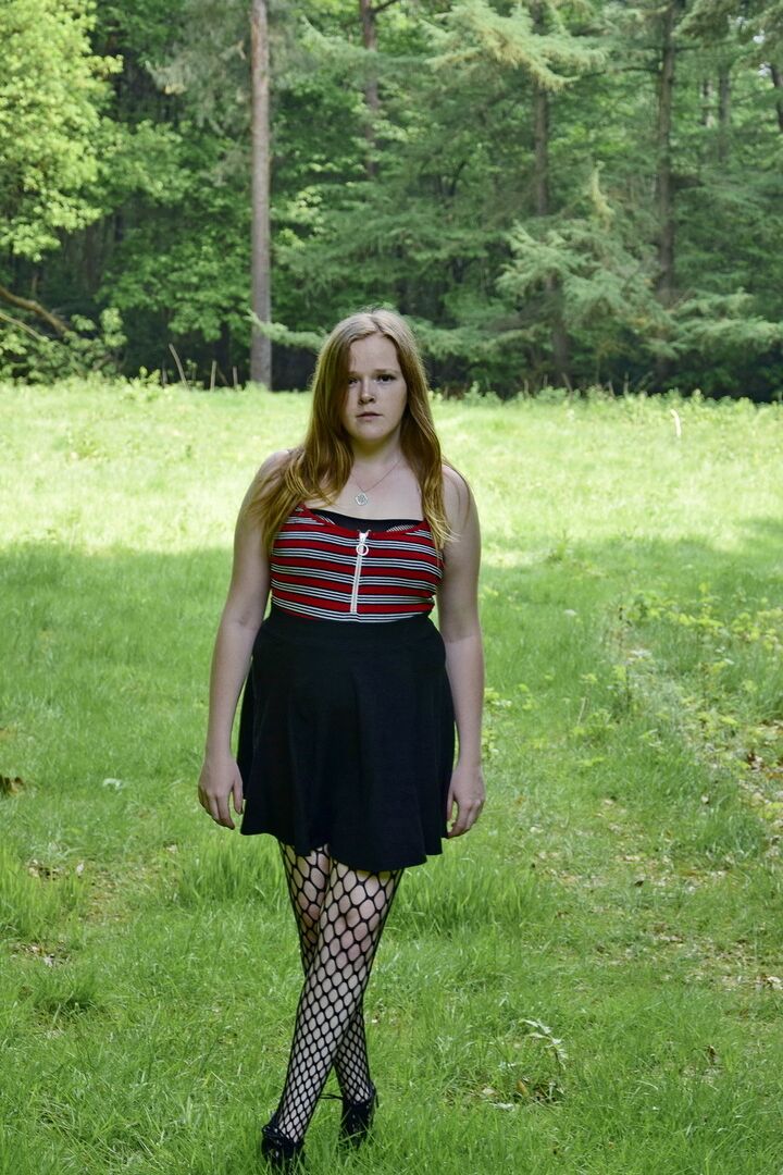 16P Redheaded amateur exposes her tits during upskirt action in a field