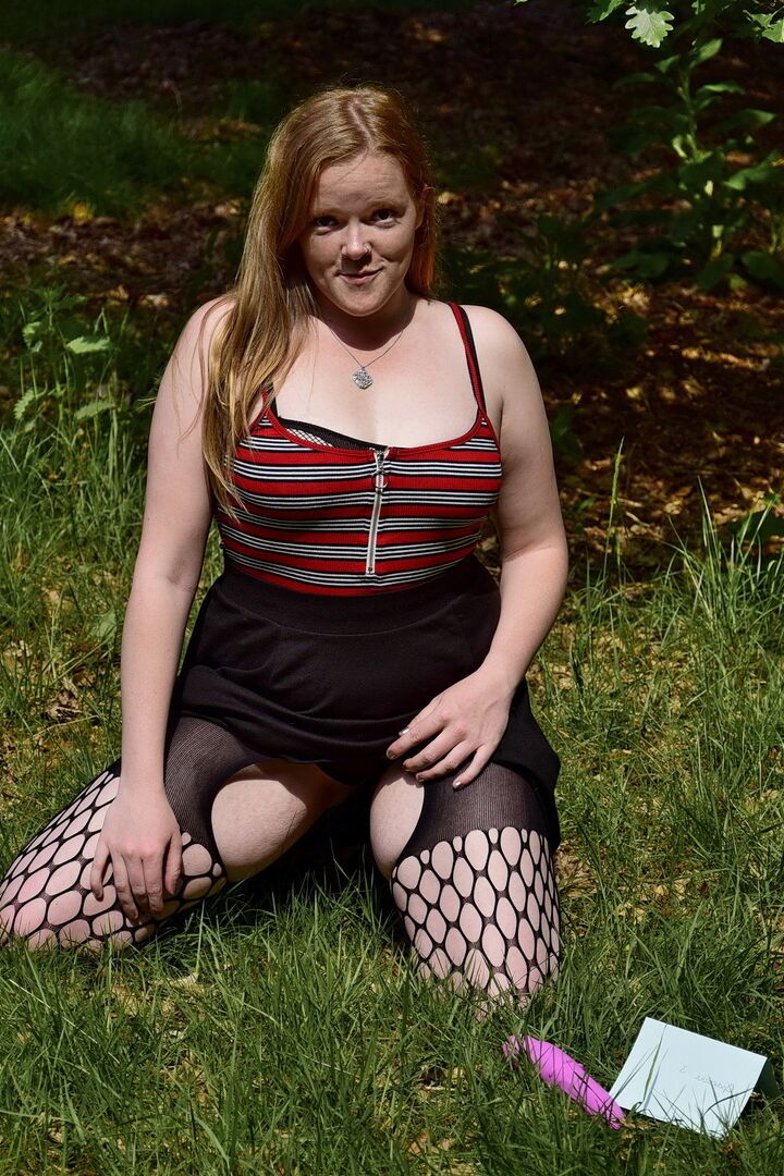16P Redheaded amateur exposes her tits during upskirt action in a field
