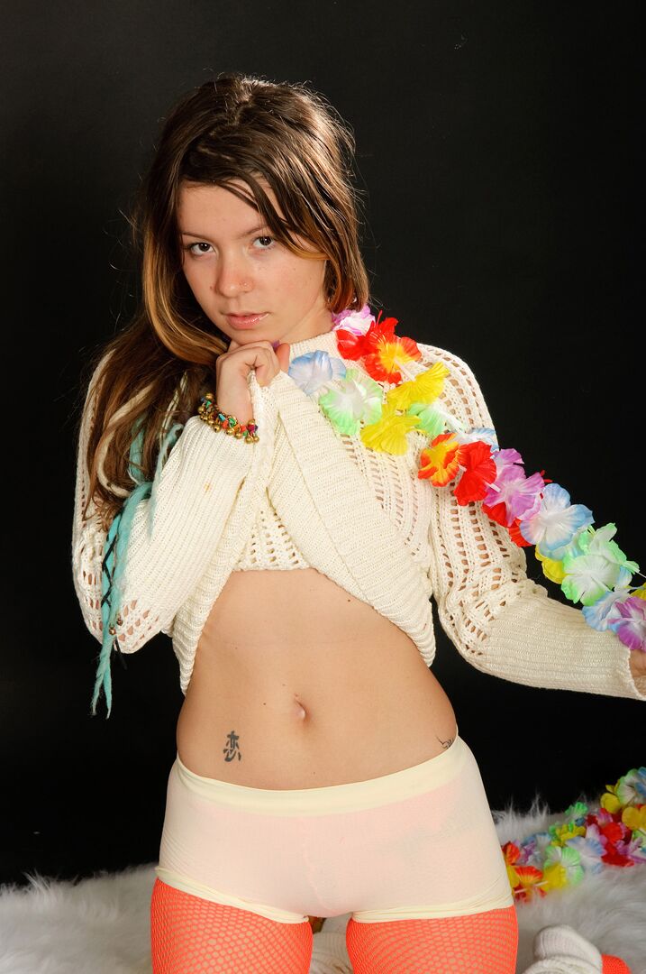 15P Emily 18 wears a sweater, red fishnet pantyhose, and skintight boyshort