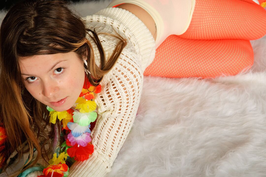 15P Emily 18 wears a sweater, red fishnet pantyhose, and skintight boyshort