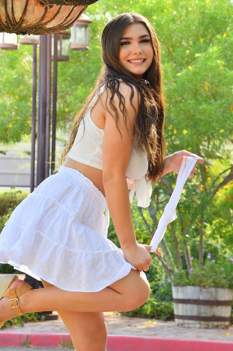 15P Amateur model Aria exposes her upskirt thong while in the garden