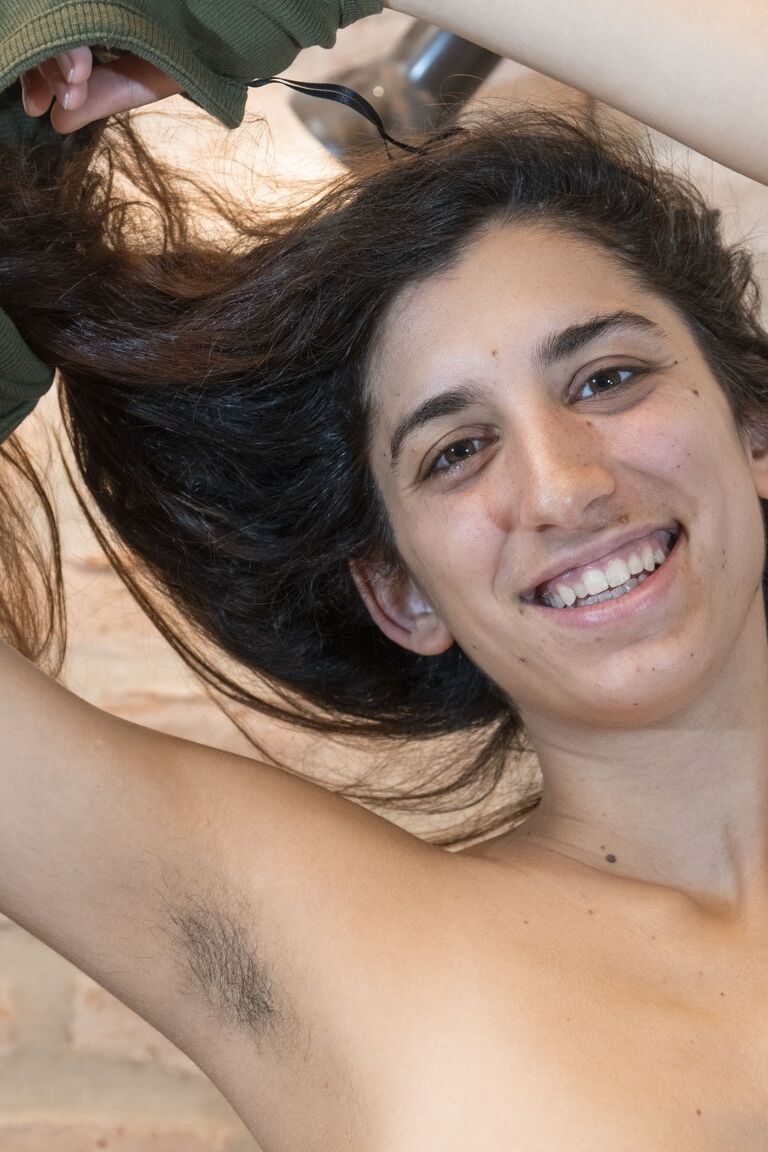 21P Cute hippie Sofia H displaying her furry vagina on the wooden desk