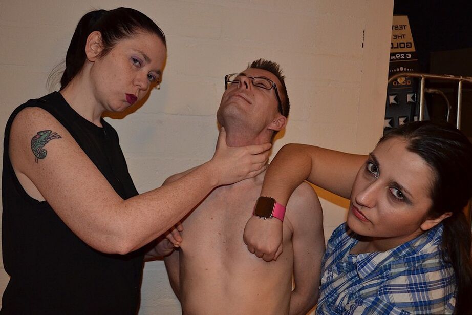 20P Clothed females whip and spank a naked man's ass after he worships their boots