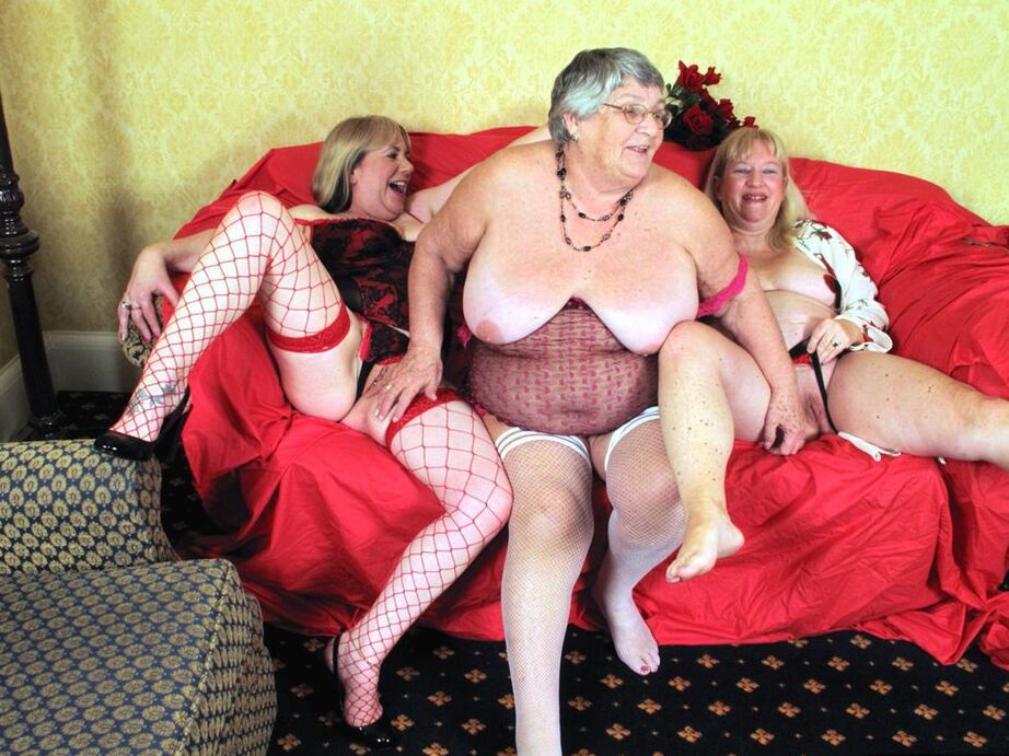 20P Fat nan Grandma Libby fondles a couple of older women's vaginas on a loveseat
