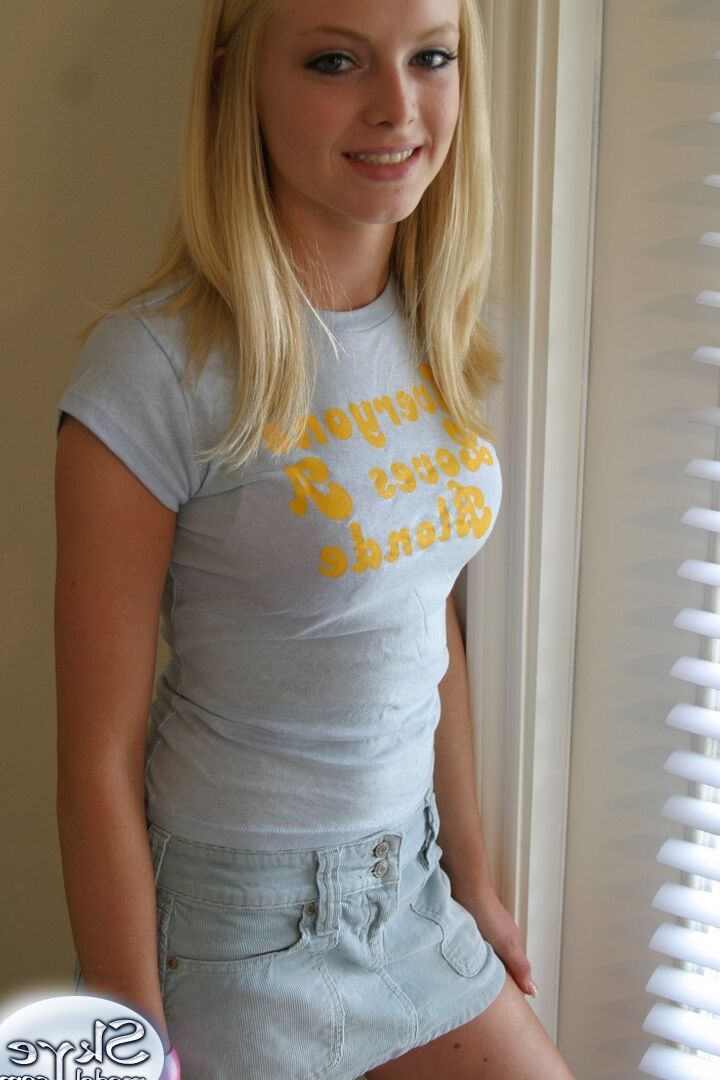 12P Blonde amateur Skye Model models by herself in a short skirt