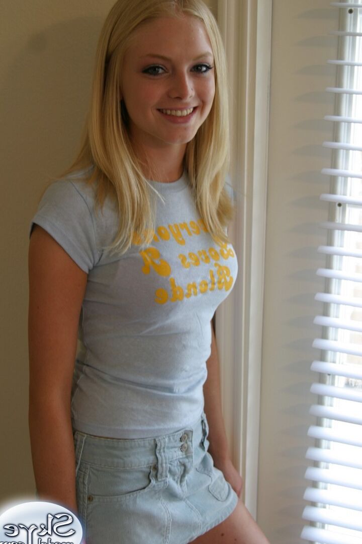 12P Blonde amateur Skye Model models by herself in a short skirt