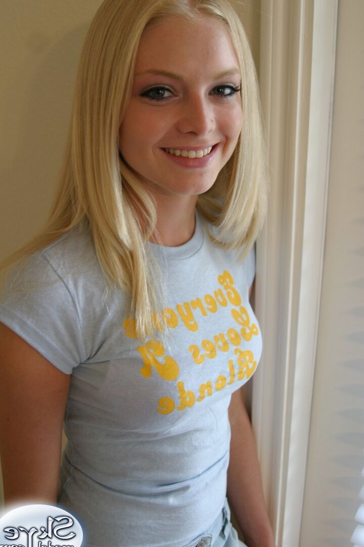 12P Blonde amateur Skye Model models by herself in a short skirt