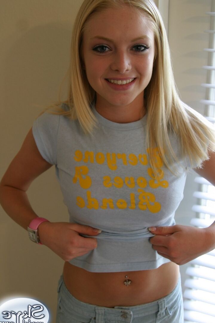12P Blonde amateur Skye Model models by herself in a short skirt