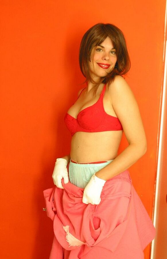 12P Amateur model exposes her boobs while adorned in retro underthings